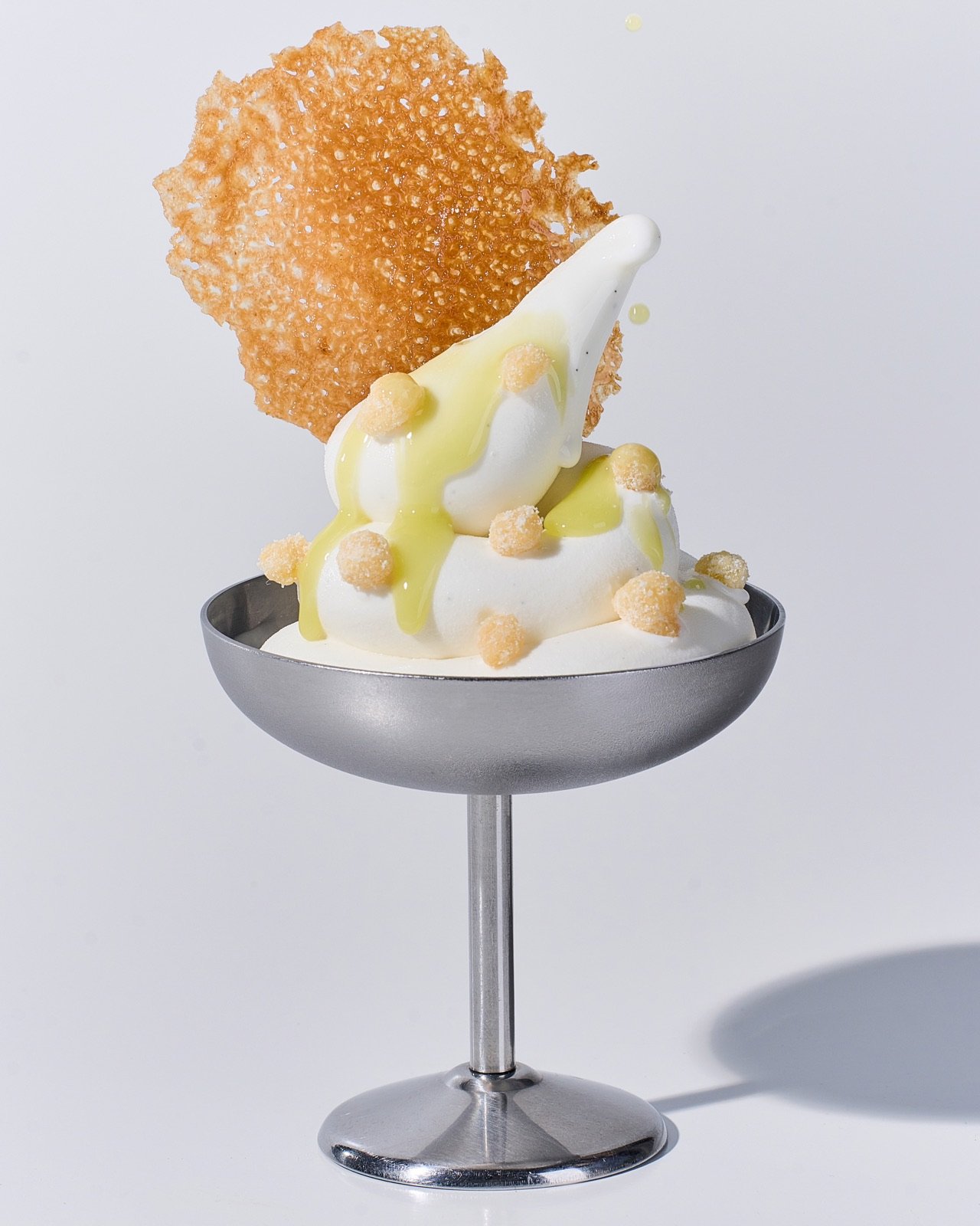 Ame: olive oil glaze, yogurt crumb, caramel tuile